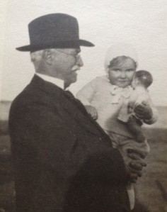 Mom at 2 with doll and Grandfather